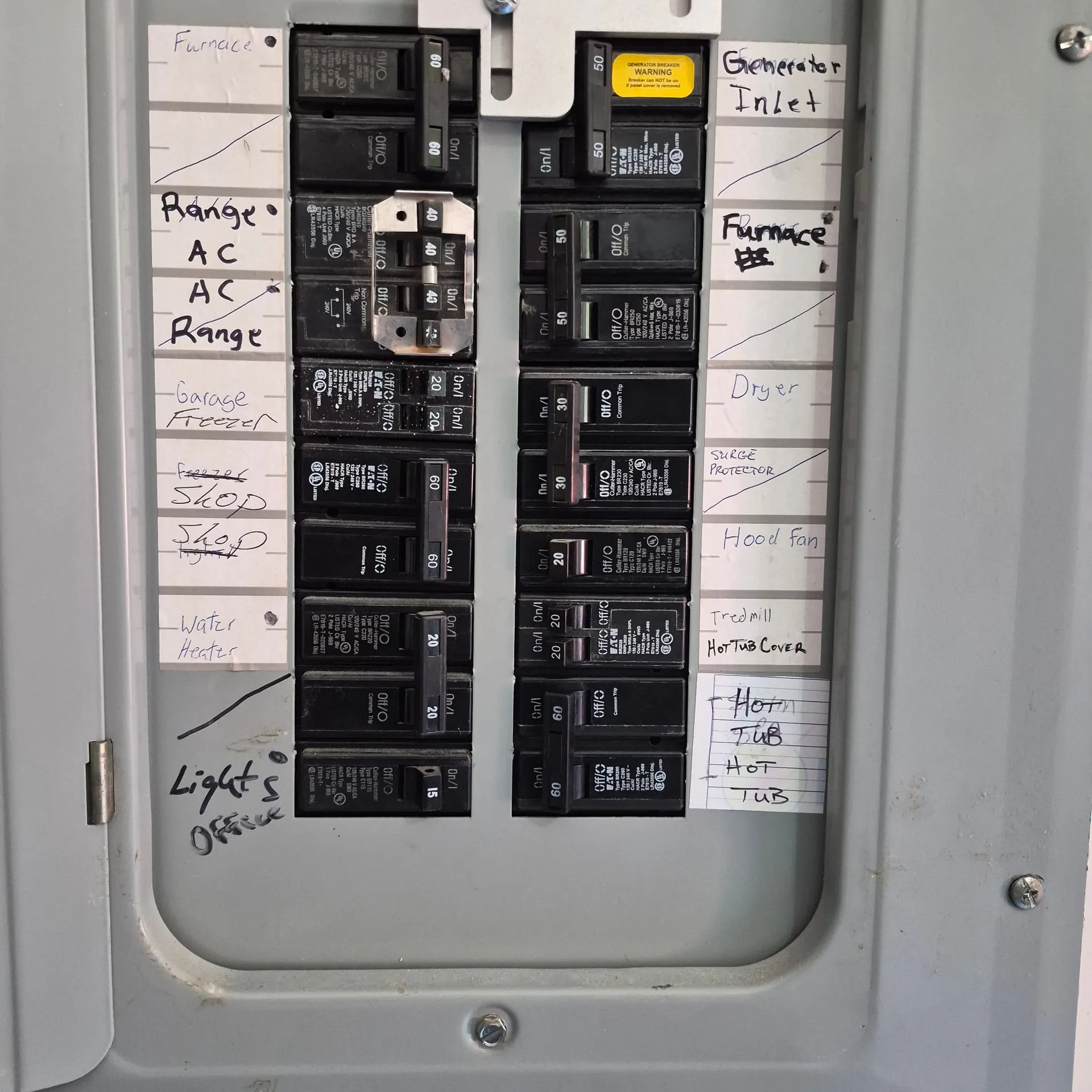 Electrical panel directory at a Brush Prairie WA home showing the new hot tub and hot tub cover circuits added alongside existing generator inlet, range, and AC breakers