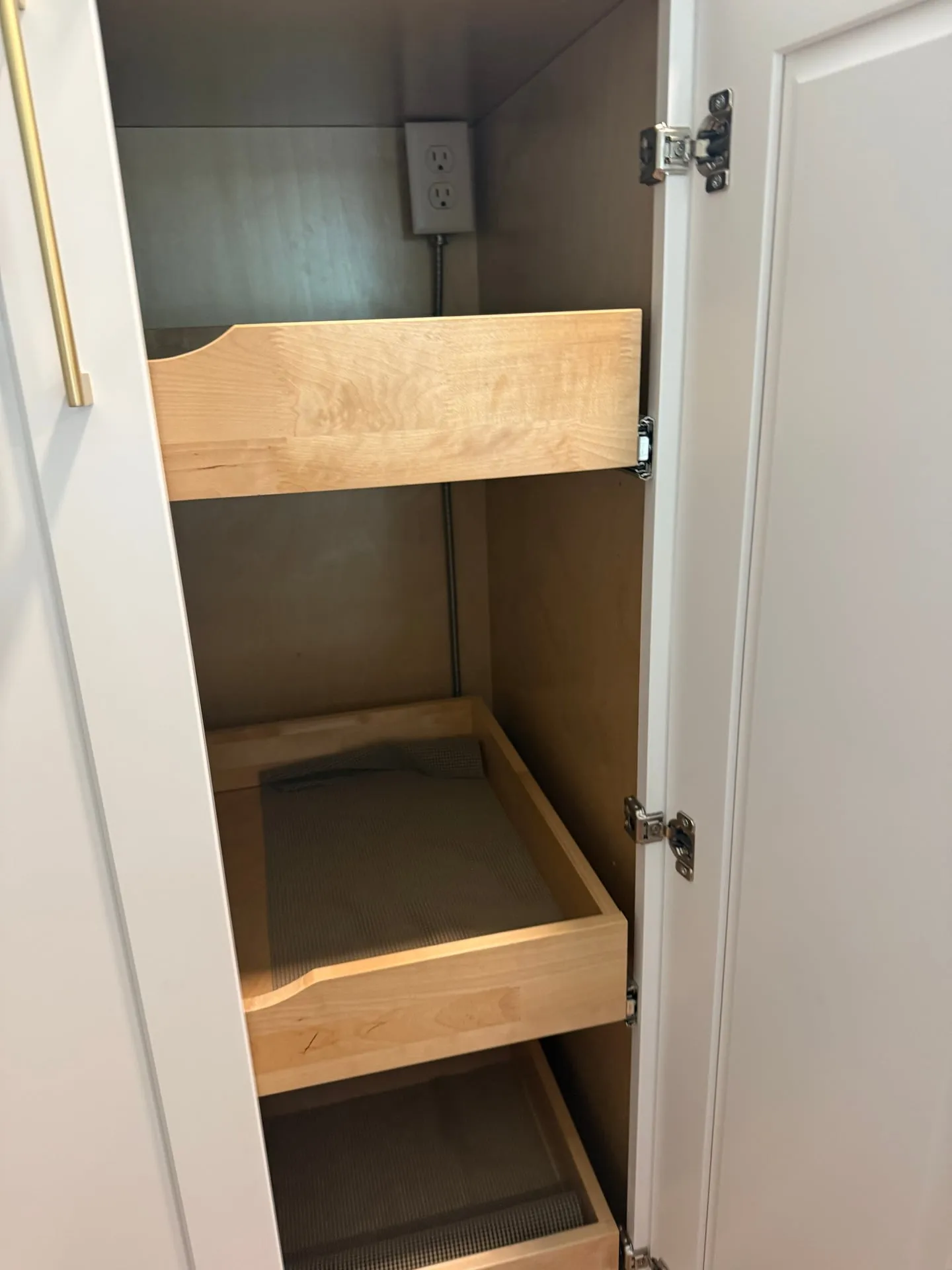New pantry microwave outlet installed in the remodeled Hazel Dell kitchen, with Romex routed up to the box from the crawlspace and a pull-out shelf below ready for the appliance