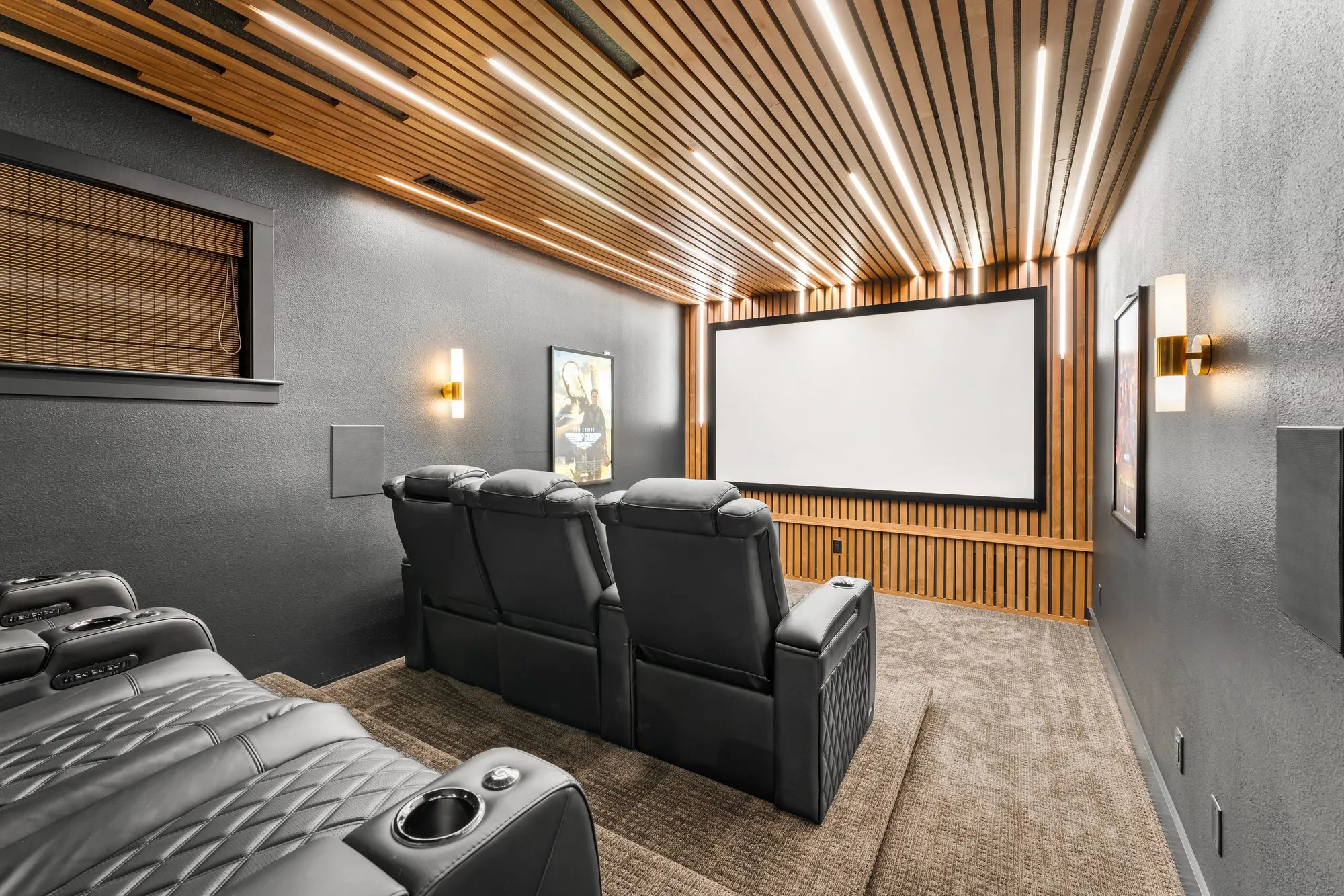 Home theater with wood slat ceiling and integrated LED lighting wired by Newman Electric in Vancouver WA