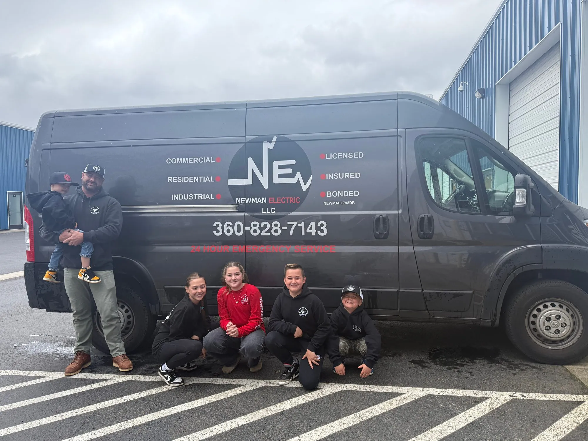 Newman Electric box truck at a parking lot lighting installation