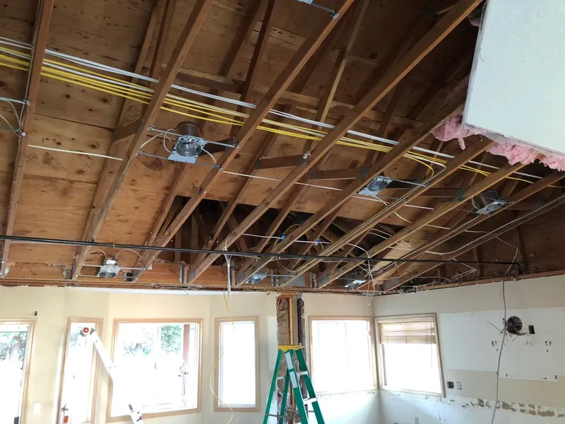 Open ceiling showing new electrical wiring during whole house rewire by Newman Electric